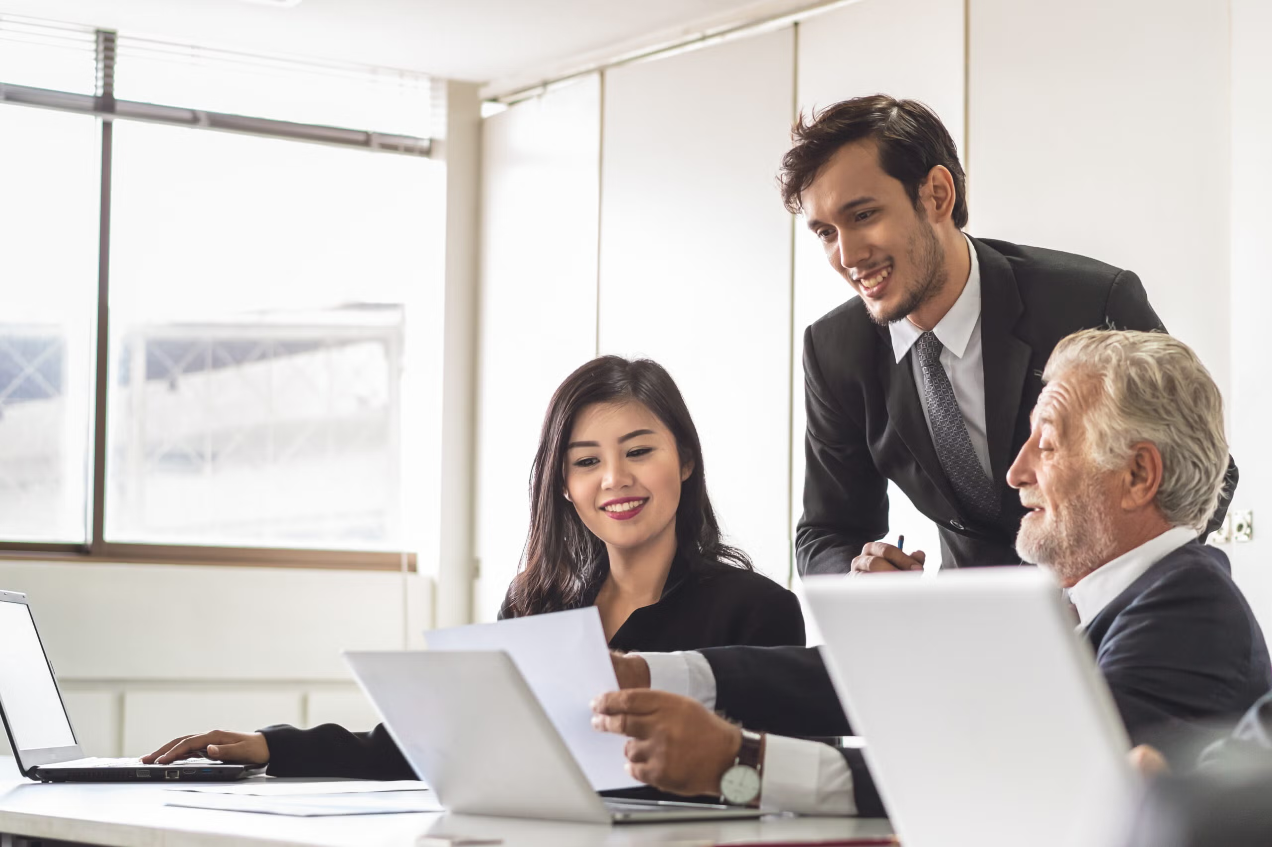 businessman in a meeting - How to Dissolve an LLC in Rhode Island