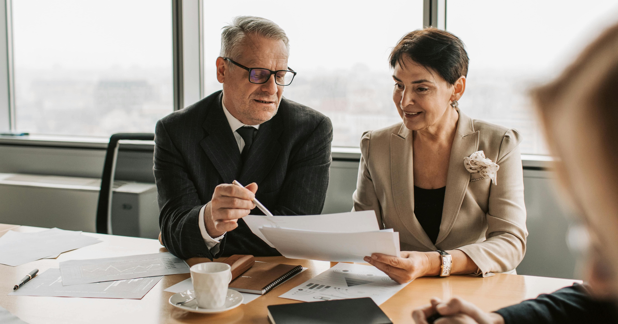 person looking at document - How to Dissolve an LLC in Missouri