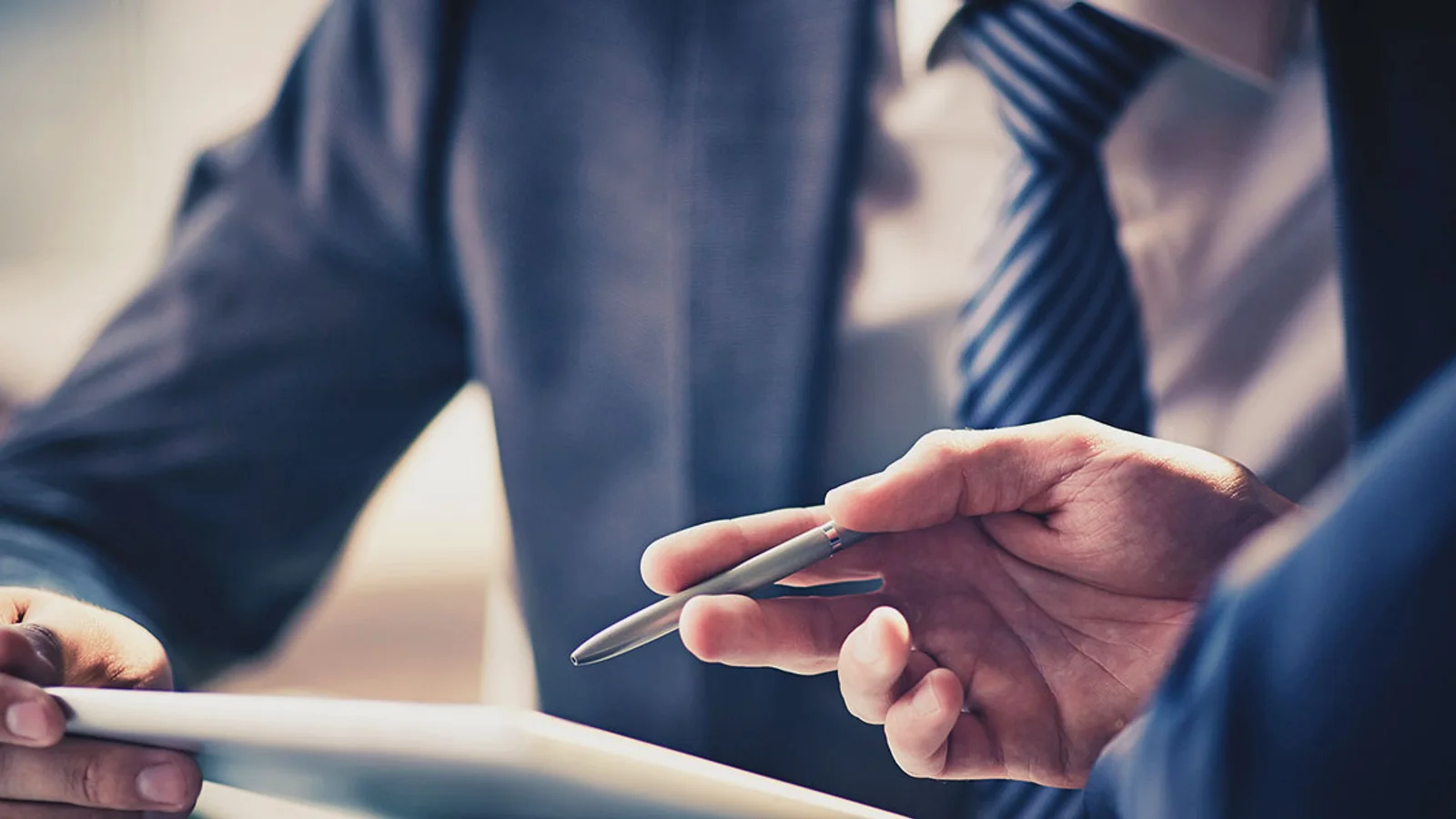 man looking at a important document - How to Dissolve an LLC in Indiana 