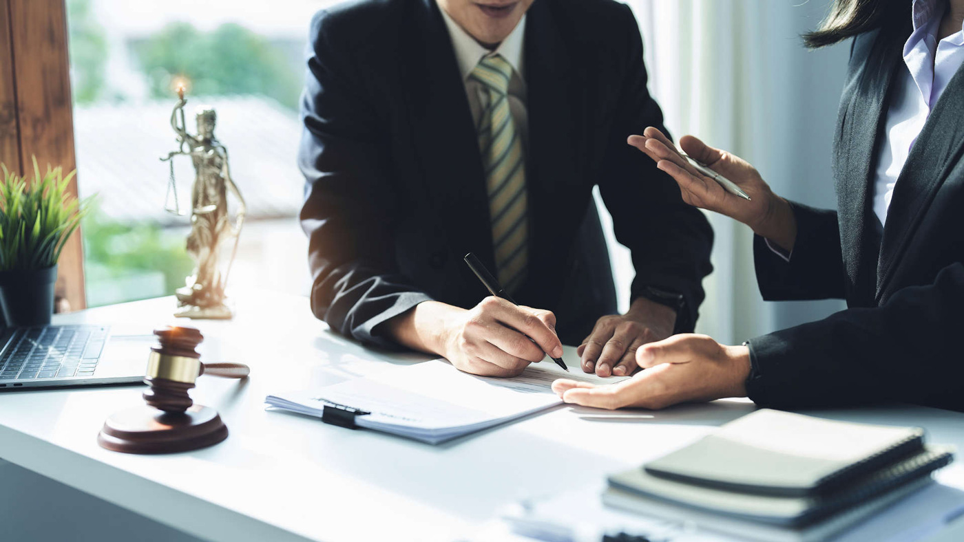 man signing - How to Dissolve an LLC in Arizona 