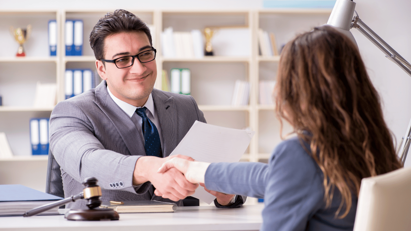 man shaking hand - How to Dissolve an LLC in Wisconsin 