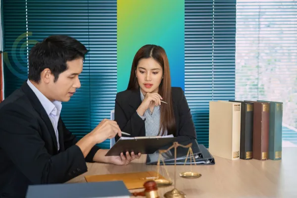 woman with her advisor - How To Dissolve An LLC In Texas