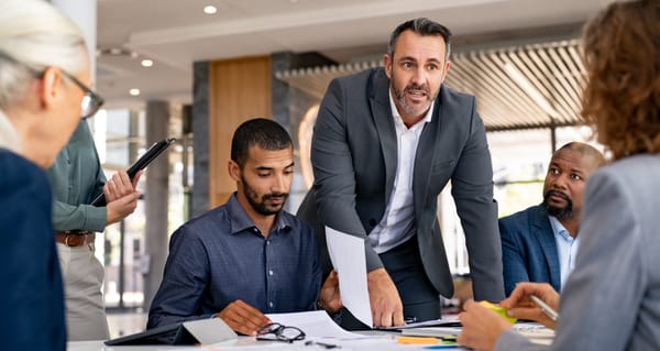 person looking at documents - How to Dissolve an LLC in Arkansas